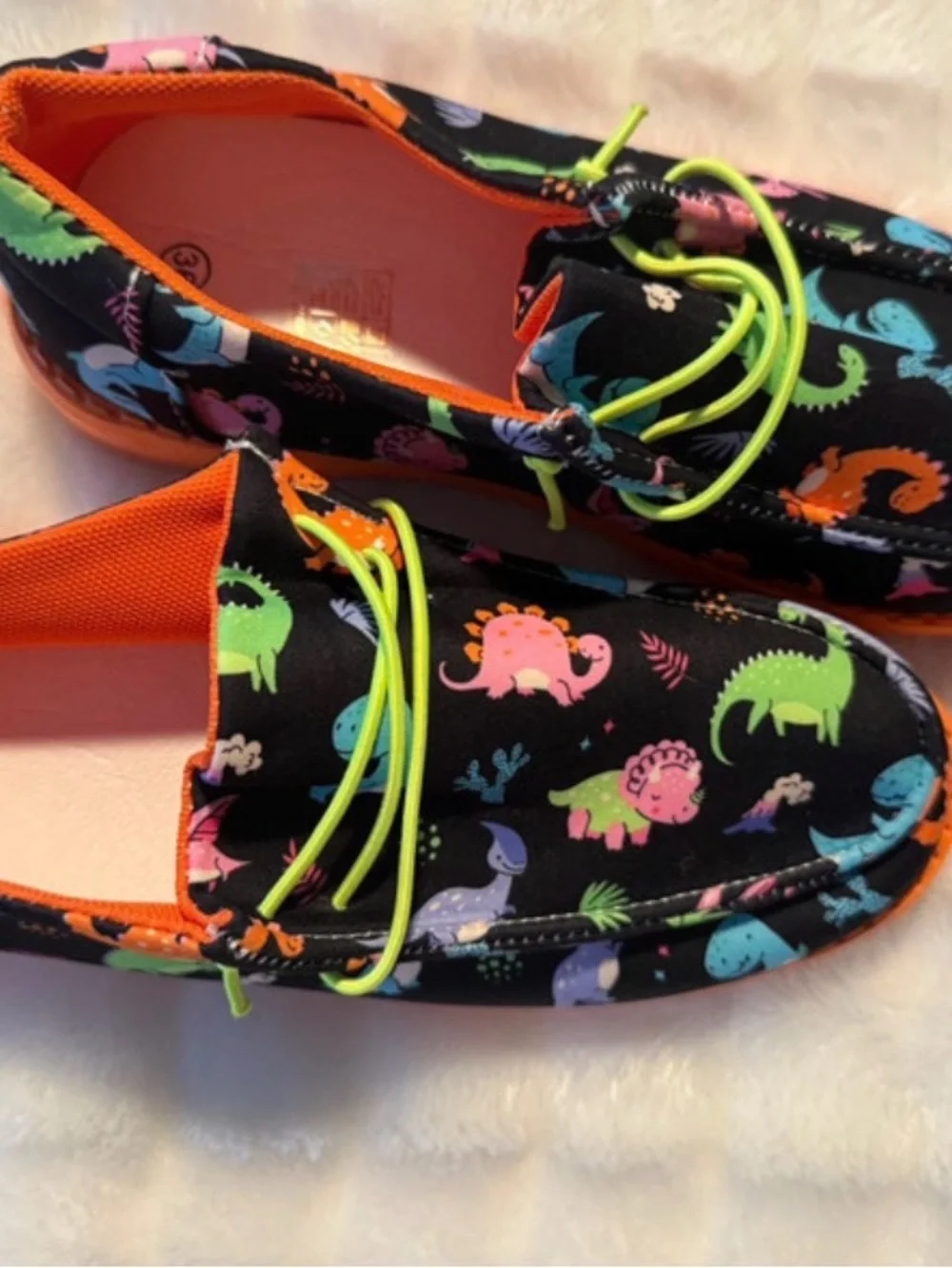 Kids Black Dinosaur Print Slip-On Shoes with Orange Sole